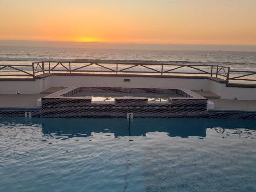 a swimming pool on a cruise ship with the ocean at Casa Mar Verde - Oceanfront Penthouse - Pool & Jacuzzi in Primo Tapia