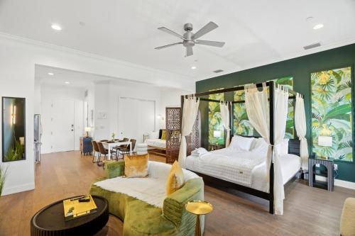 a bedroom with a bed and a living room at Casa Ybor Apartments on 7th Ave in Tampa