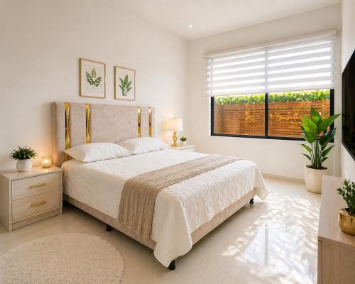 a bedroom with a large bed and a window at Espectacular Casa Quinta in Girardot
