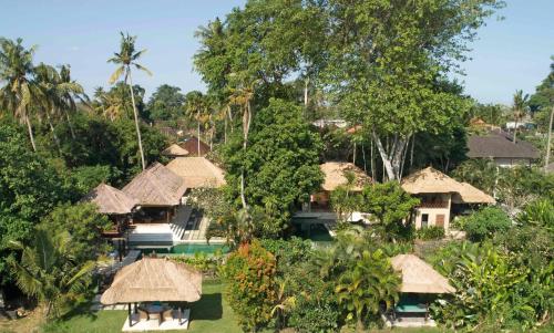 an aerial view of a resort with trees at Tamu Seseh in Canggu