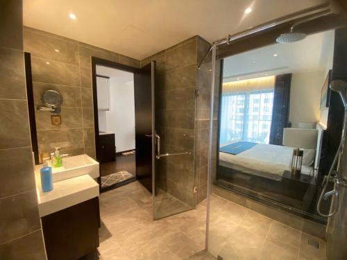 a bathroom with a shower and a sink and a shower at Sapphia Hạ Long in Ha Long