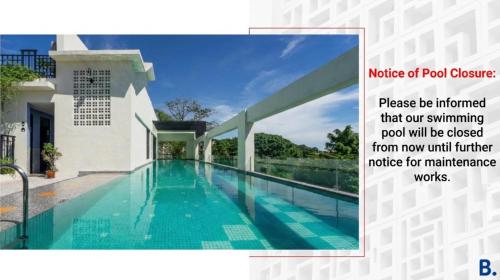 a picture of a swimming pool in a house at Treasures Hotel and Suites in Malacca