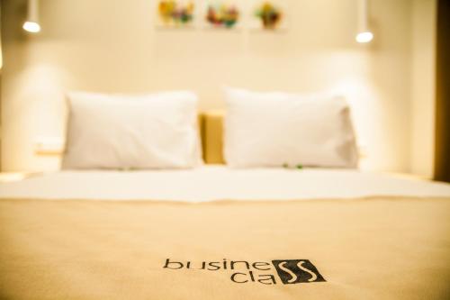 Postel nebo postele na pokoji v ubytování Cluj Business Class