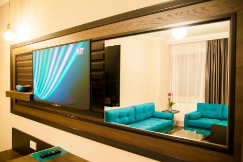 TV a/nebo společenská místnost v ubytování Cluj Business Class
