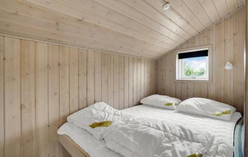 a bedroom with two beds in a room with a window at Activity House - Flovt Strand Haderslev in Haderslev