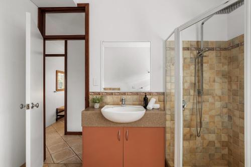 a bathroom with a sink and a shower at Sidney Laine - Family Friendly - Private in Margaret River Town