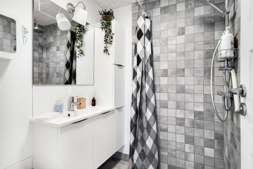 a bathroom with a shower and a sink at Holiday In The First Row To The Water in Dannemare