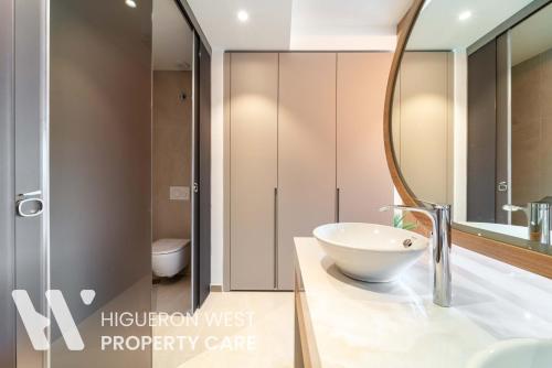 a bathroom with a sink and a mirror on a counter at The Horizon - Luxury 3-Bedroom with Private Plunge Pool and Terrace, South Residences, Higueron Resort, Fuengirola in Fuengirola