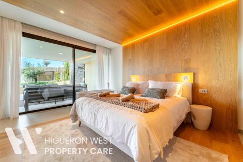 a bedroom with a large bed and a balcony at The Horizon - Luxury 3-Bedroom with Private Plunge Pool and Terrace, South Residences, Higueron Resort, Fuengirola in Fuengirola