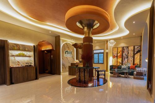 a lobby with a large room with a ceiling at NiK Hotel Hillside Da Lat in Da Lat