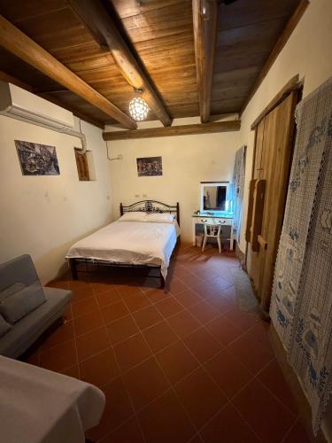 a bedroom with a bed and a table in it at Kinmen Courtyard in Jincheng