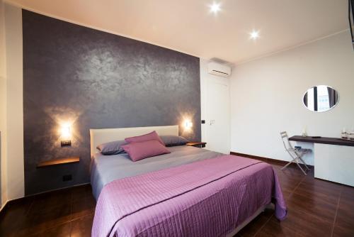 Ένα ή περισσότερα κρεβάτια σε δωμάτιο στο Glam House