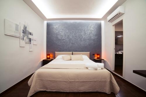 Ένα ή περισσότερα κρεβάτια σε δωμάτιο στο Glam House