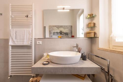 a bathroom with a large bowl sink on a counter at Villa Atusca - Castiglioncello in Castiglioncello