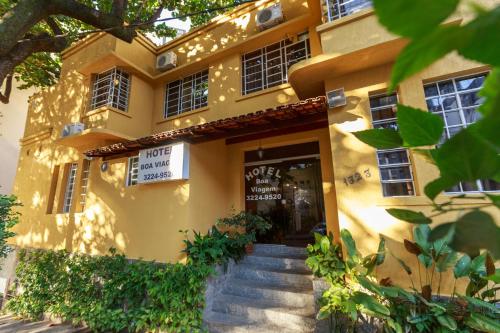 a building with stairs leading to the front door at Hotel Boa Viagem in Belo Horizonte