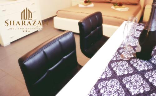 a dining room table with a black and white table cloth at Sharazan in Canicattì