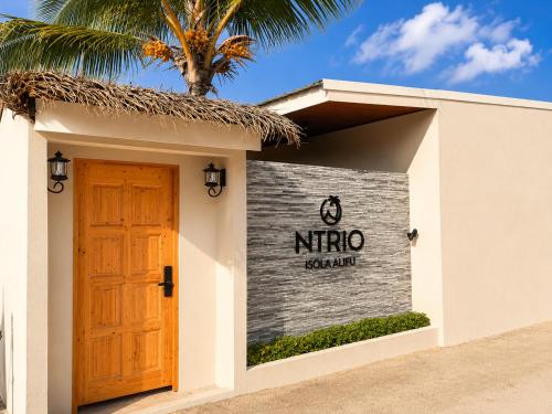 a door to a nirro sign on a building at Isola Alifu in Feridhoo