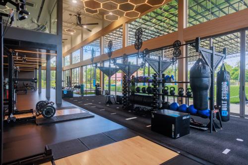 a gym with lots of exercise equipment in a building at Maraleina Sports Resort in Nathon Bay