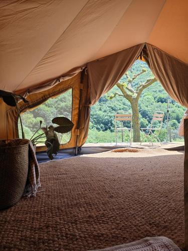 a tent with a view of a tree at Nova Forest Montseny in Montseny