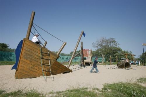 a group of people playing in a playground at Friesenhof in Friedrichskoog