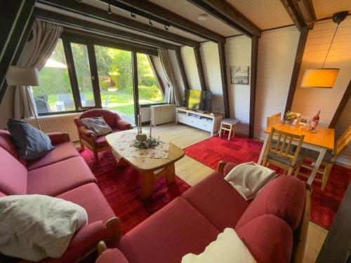a living room with a couch and a table at Bodenseehäusle in Immenstaad am Bodensee