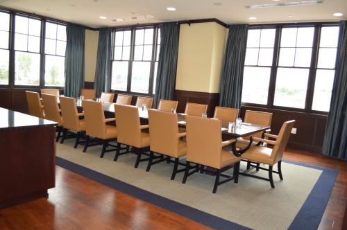 a large conference room with a long table and chairs at The Inn at Harbor Shores in Saint Joseph