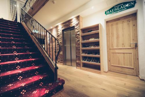 a staircase in a building with a wine cellar at Hotel Bellevue in Bad Wiessee