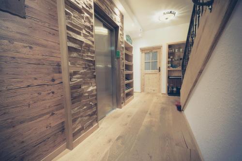 a hallway with a wine cellar with wooden walls at Hotel Bellevue in Bad Wiessee