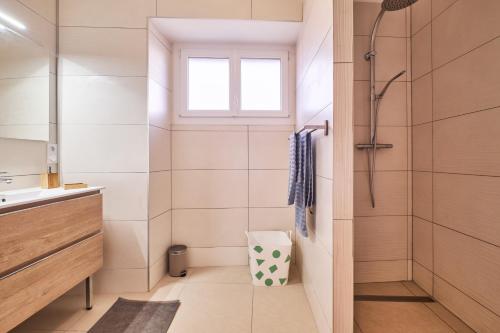 a bathroom with a shower and a sink at Chez Emile in Brézins