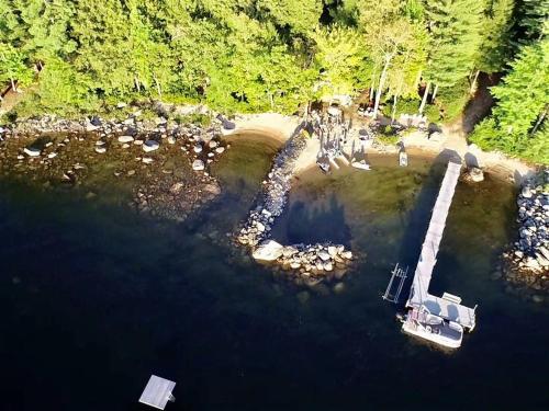 an aerial view of a bridge over a lake at BEACHSIDE ON SEBAGO LIMIT 6 villa in Standish