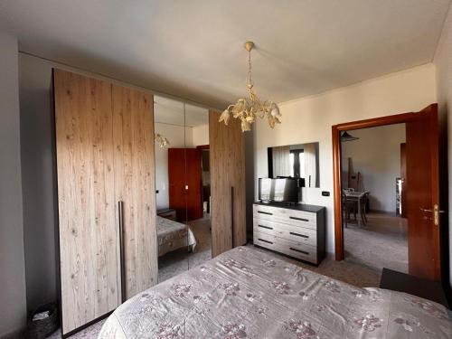 a bedroom with a bed and a dresser and a mirror at Dimora Civita in Castelcivita