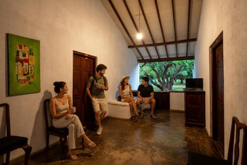 a group of people sitting in a room at WildEscape, Yala Blocks 3, 4 & 5 in Buttala