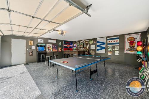 a room with a ping pong table in it at Peaceful Lake Como Retreat in Lake Geneva