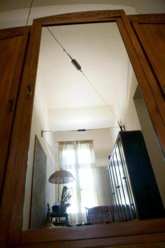 a view of a living room through a glass door at Appartamento Le Corti 2 in Alessandria