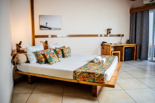 Llit o llits en una habitació de Moringa Hotel