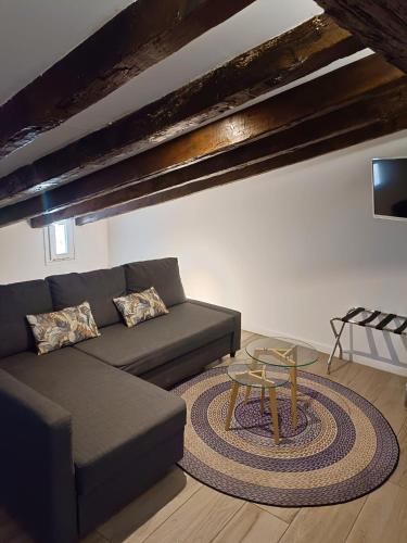 a living room with a couch and a table at Hotel El Siglo in Valencia