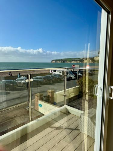 a balcony with a view of a parking lot at Mariners Hotel in Seaton