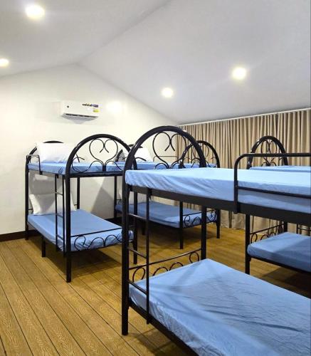 a group of bunk beds in a room at The Stables by L' Rancho Danilo in Banaba