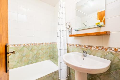 a bathroom with a sink and a shower at Ca n'Antonia in Sóller