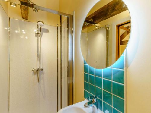 a bathroom with a sink and a mirror at 3 Bed in Usk- oc-87286 in Llandenny