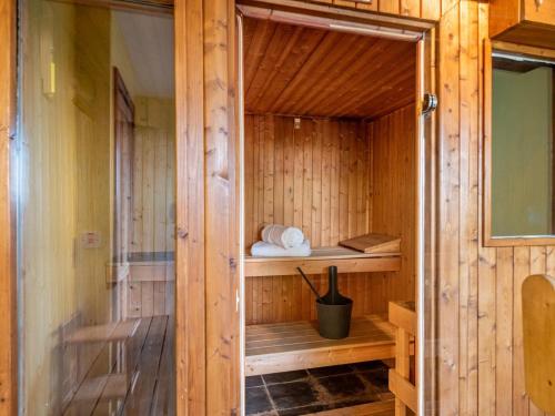 a wooden sauna with a wooden floor and a glass door at 5 Bed in Llangammarch Wells oc-bn162 in Garth