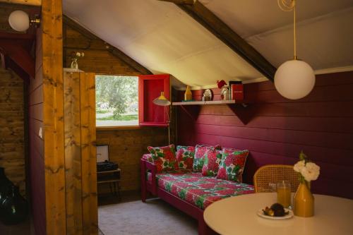 a living room with a couch and a table at Braccialieri Luxury Resort in Avola