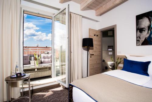 En eller flere senge i et værelse på Hotel Atlas Leipzig