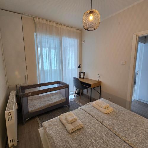 a bedroom with two beds and a desk and a mirror at Landmark 1BDR Apartment in Center, next to Metro in Sofia
