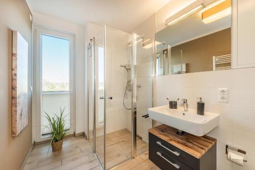 a bathroom with a sink and a shower at Ein Traum am Haff in Zirchow