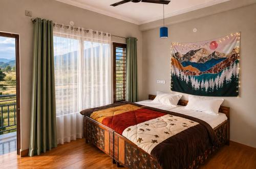 a bedroom with a bed and a large window at Aahista Stays- Mountain view homestay in Bīr