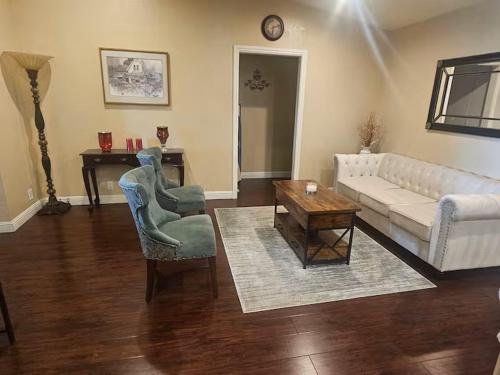 a living room with a couch and a table at Urban Retreat -Suite B in San Jose