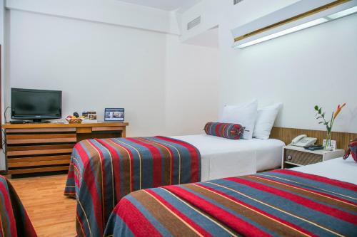 Ліжко або ліжка в номері San Agustin Riviera