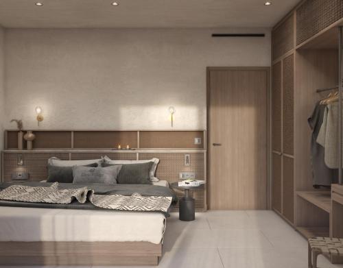 a bedroom with a large bed in a room at Eleni Village & Suites in Amoudara Herakliou