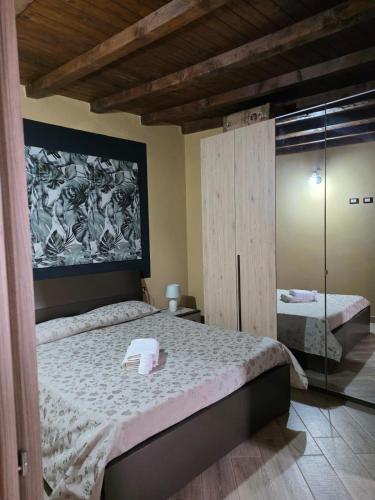 a bedroom with a bed with a towel on it at Villa la Perla in Lampedusa